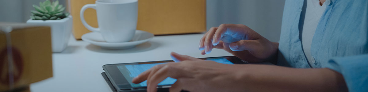 image of woman using tablet