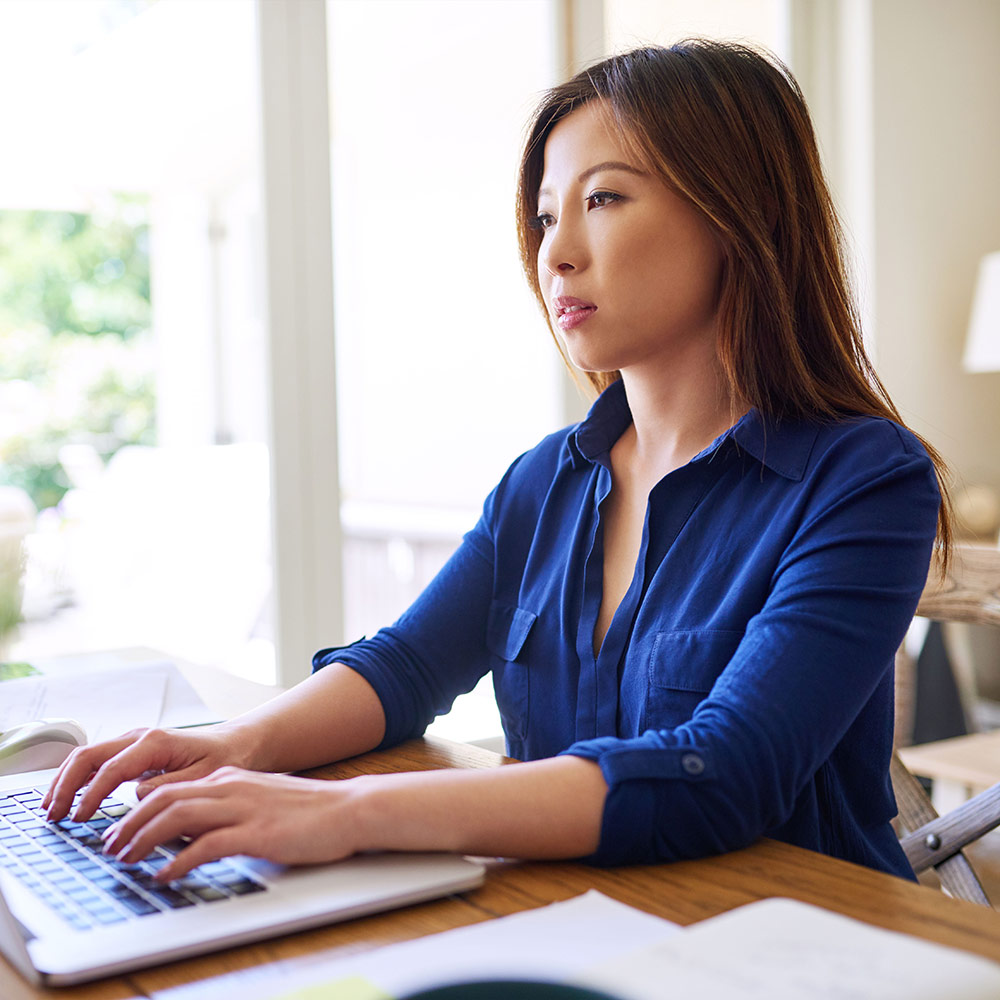 image of asian female business owner using laptop